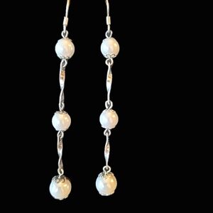 Long dangle pearl style earrings